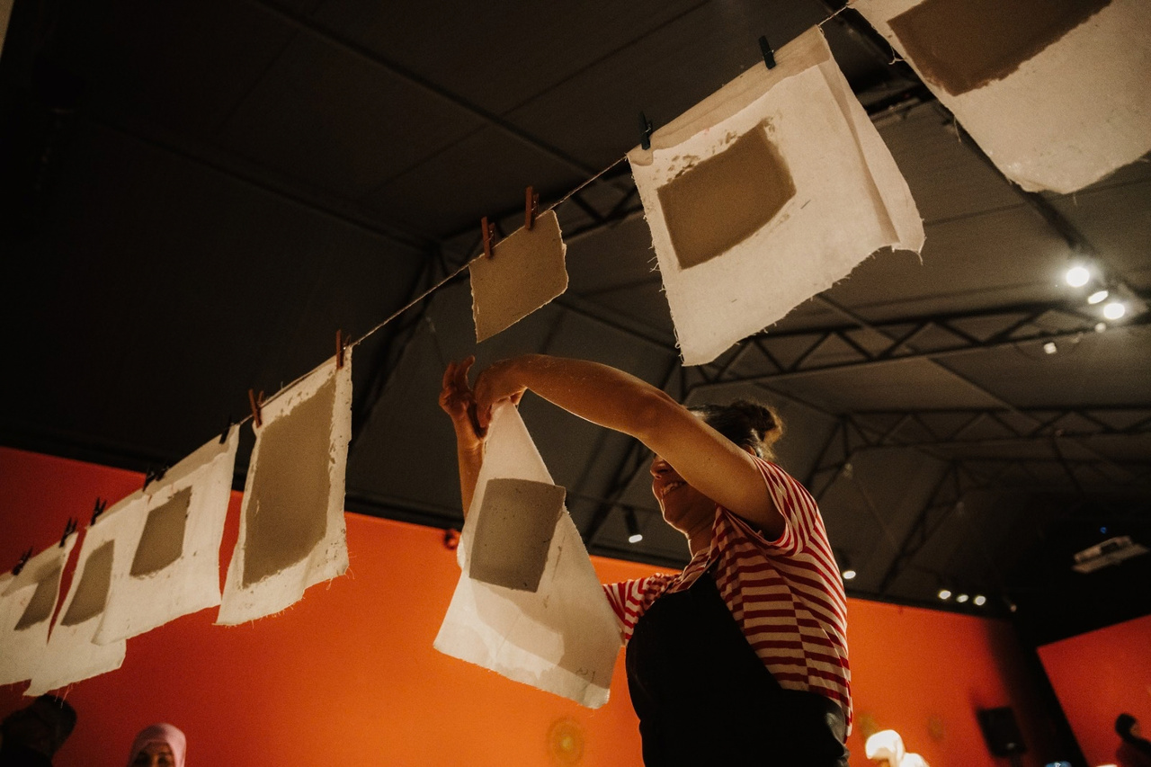 Handmade paper drying on a line